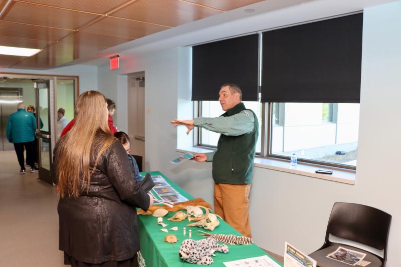 Richard Julian, right, nature center manager for Cape Henlopen State Park, talks to visitors in one of the meeting rooms during the Biden Environmental Center open house Feb. 22.